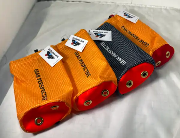 Four Gear Perspective Micro bags, three orange and one black and white